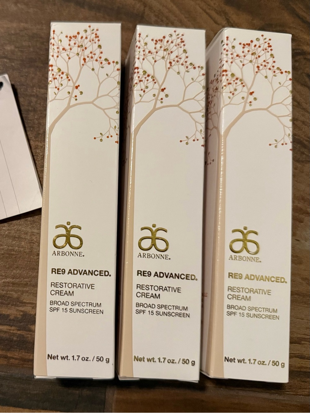 Arbonne RE9 Advanced Restorative Cream in White and Gold Accents